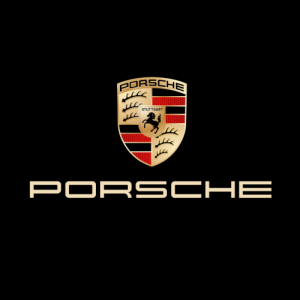 Iconic Porsche logo with four red and four black stripes on a golden background, featuring a horse emblem and three antlers.